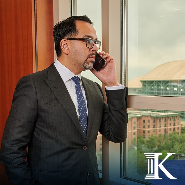 Attorney Omar Khawaja speaking on the phone to a client