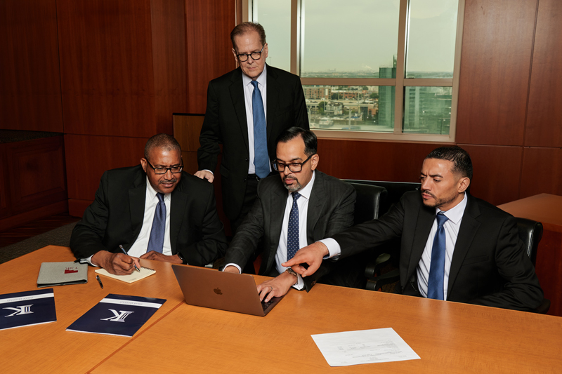 Group photo of Attorney Omar and his team of personal injury lawyers
